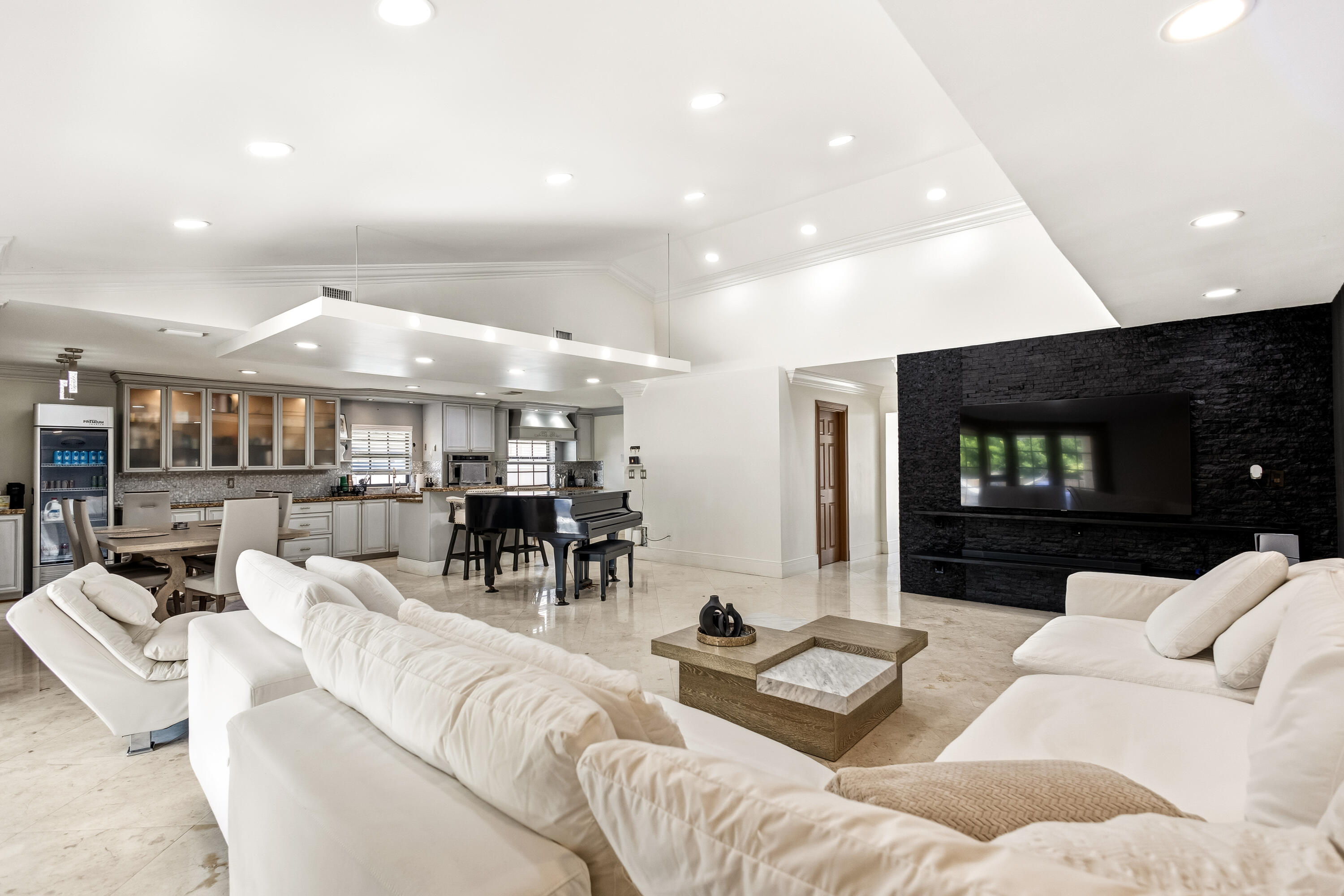 5223 Deerhurst Crescent Circle Boca Raton, FL 33486 - Photo 19 of 51 a living room with furniture and a flat screen tv