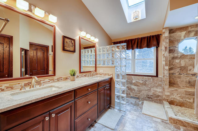 125 Briargate Road Cary, IL 60013 - Photo 12 of 24 a bathroom with a granite countertop sink mirror and a