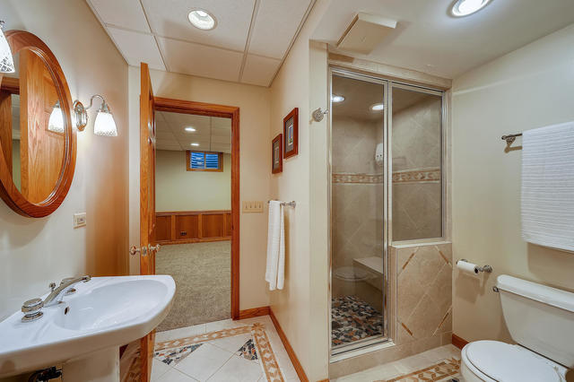 125 Briargate Road Cary, IL 60013 - Photo 17 of 24 a bathroom with a sink a toilet and shower