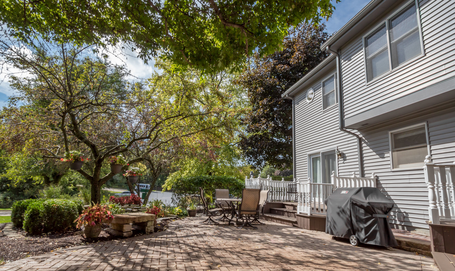 125 Briargate Road Cary, IL 60013 - Photo 19 of 24 a backyard of a house with barbeque oven and outdoor seating