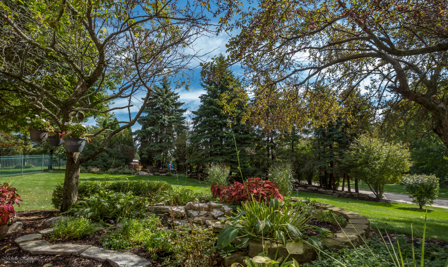 125 Briargate Road Cary, IL 60013 - Photo 20 of 24 a view of a garden with a tree