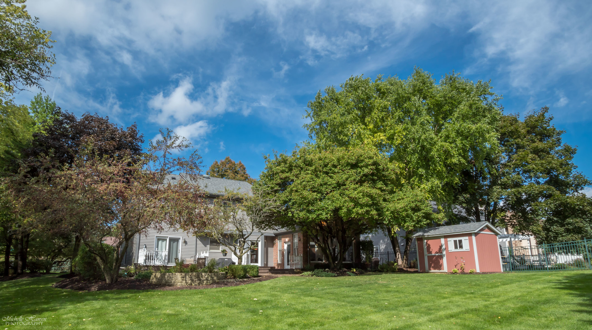 125 Briargate Road Cary, IL 60013 - Photo 21 of 24 a view of a large garden with plants and large trees