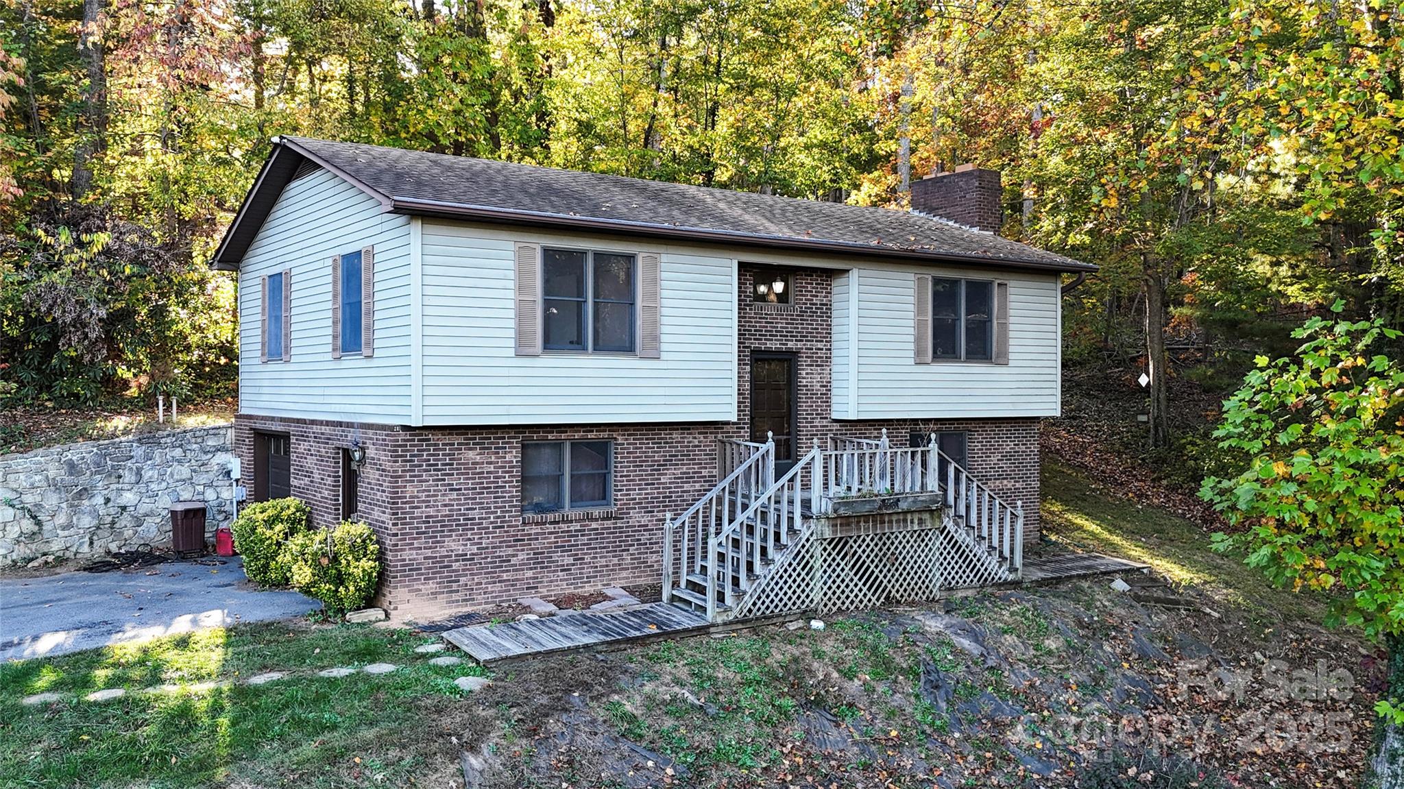 7 Windy Hollow Road Asheville, NC 28806 - Photo 1 of 39 a view of a house with a yard and plants