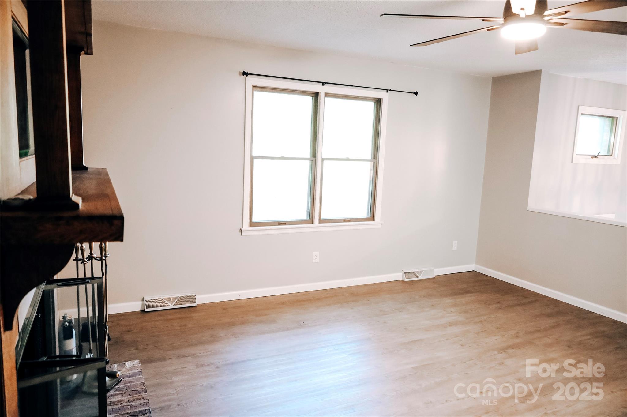 7 Windy Hollow Road Asheville, NC 28806 - Photo 13 of 39 a view of an empty room with a window