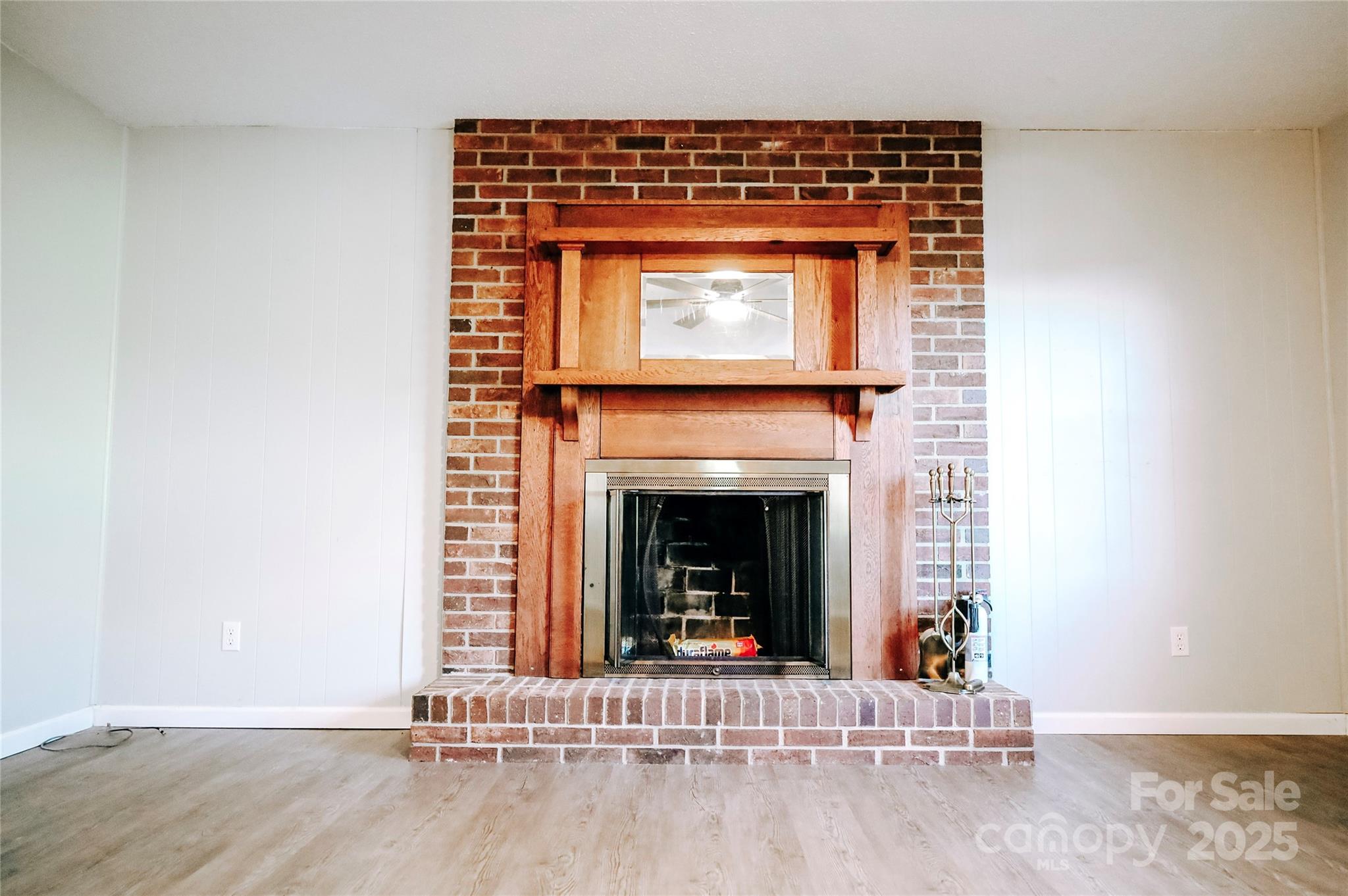 7 Windy Hollow Road Asheville, NC 28806 - Photo 14 of 39 a living room with a fireplace in it