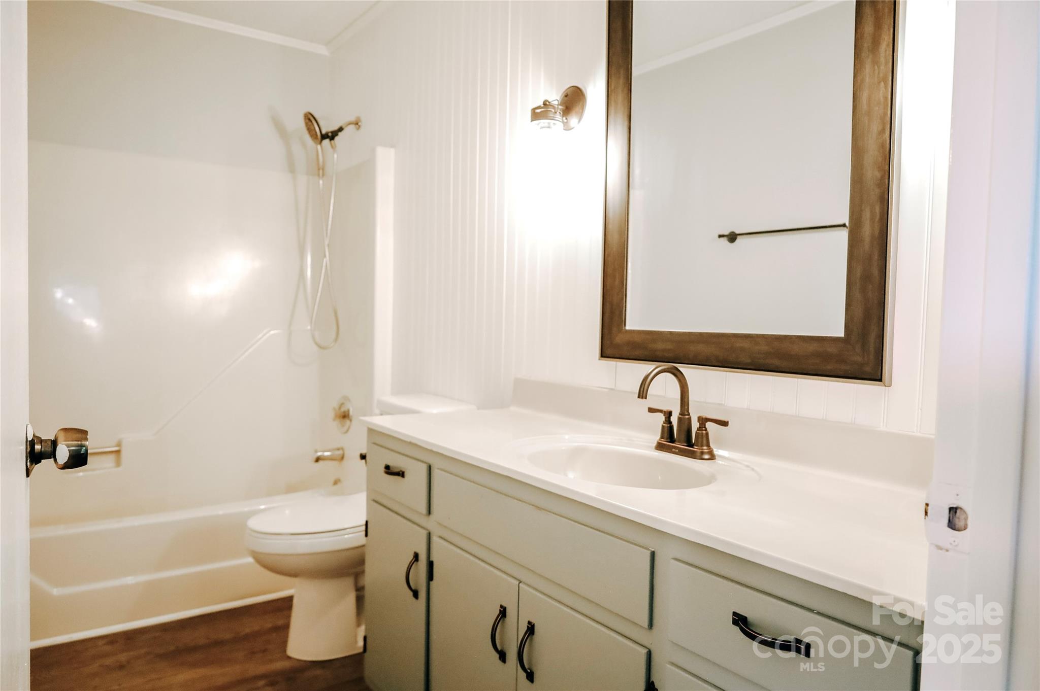 7 Windy Hollow Road Asheville, NC 28806 - Photo 15 of 39 a bathroom with a sink a toilet and shower