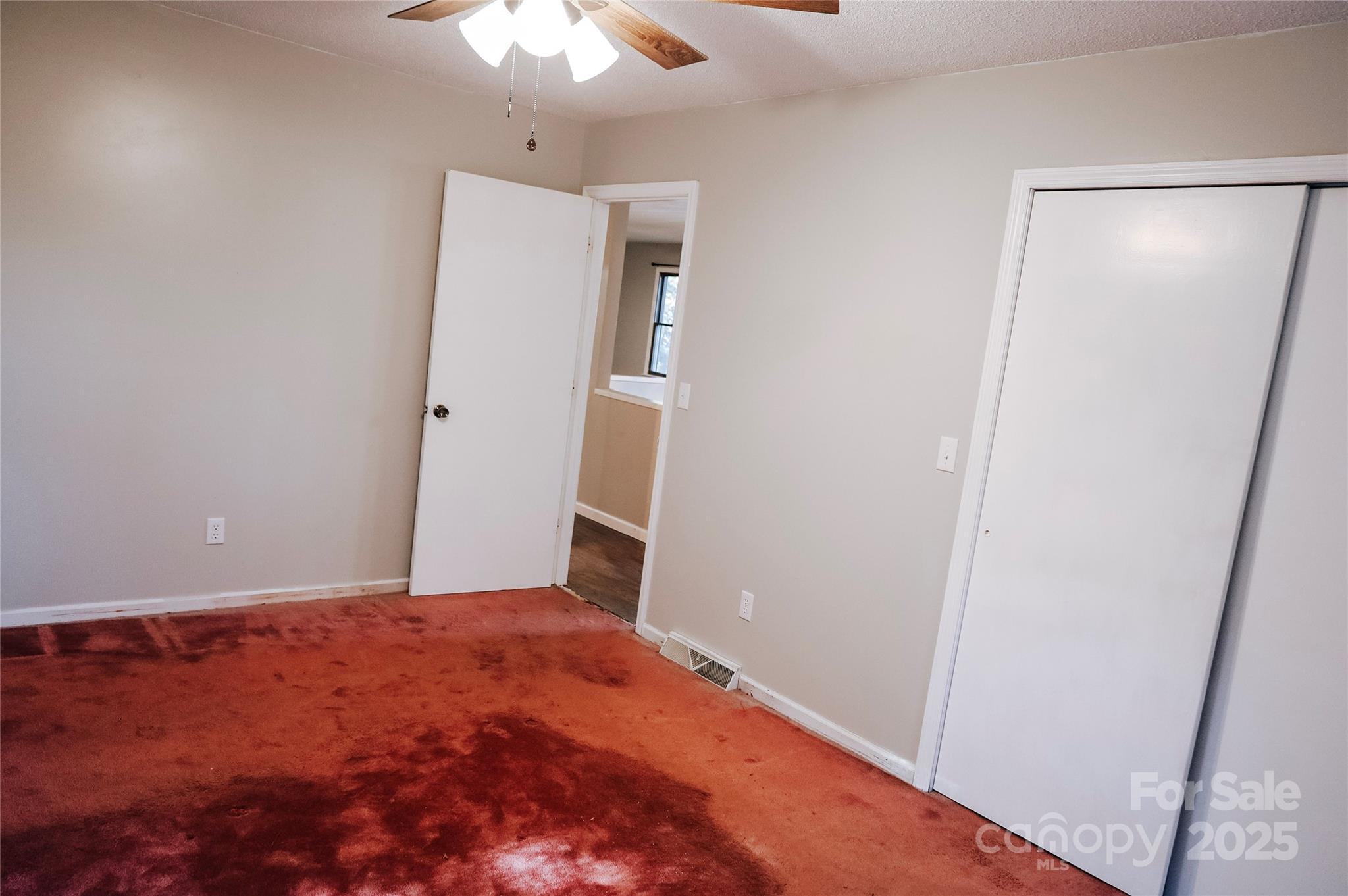 7 Windy Hollow Road Asheville, NC 28806 - Photo 19 of 39 a view of a big room with closet and chandelier fan