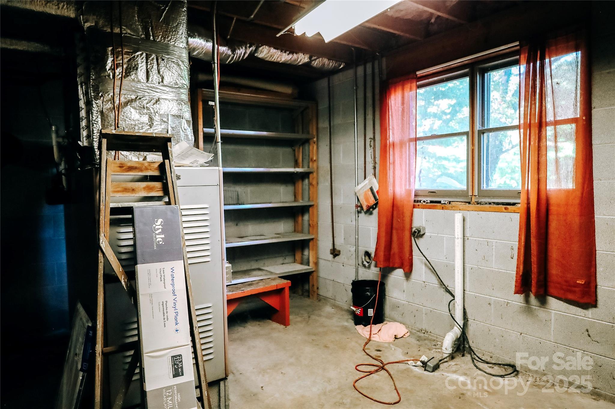 7 Windy Hollow Road Asheville, NC 28806 - Photo 24 of 39 a view of walk in closet with clothes and shoes