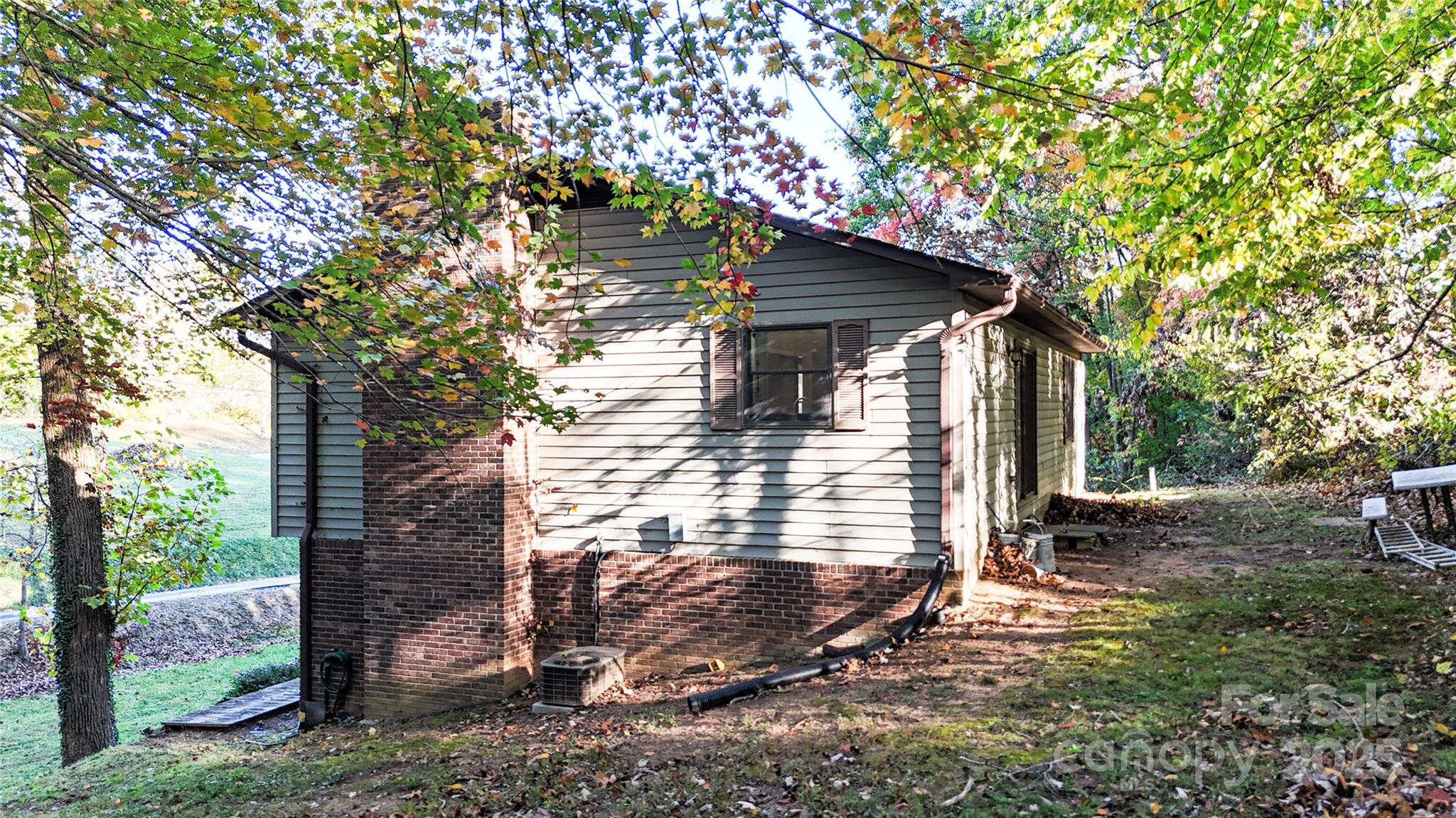 7 Windy Hollow Road Asheville, NC 28806 - Photo 30 of 39 a view of a small house with a tree