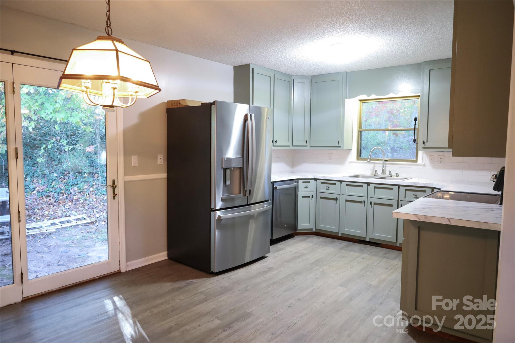 7 Windy Hollow Road Asheville, NC 28806 - Photo 5 of 39 a kitchen with a sink appliances and cabinets