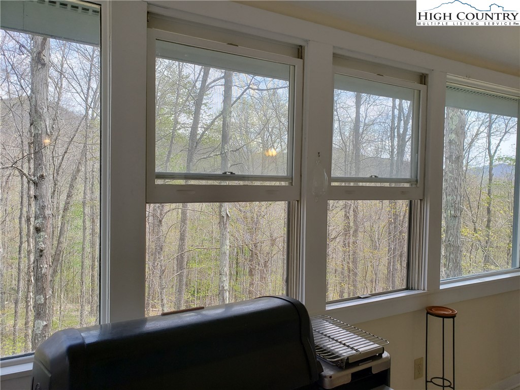 237 Green Knob Mtn Road Boone, NC 28607 - Photo 16 of 41 a room with a bed and a window