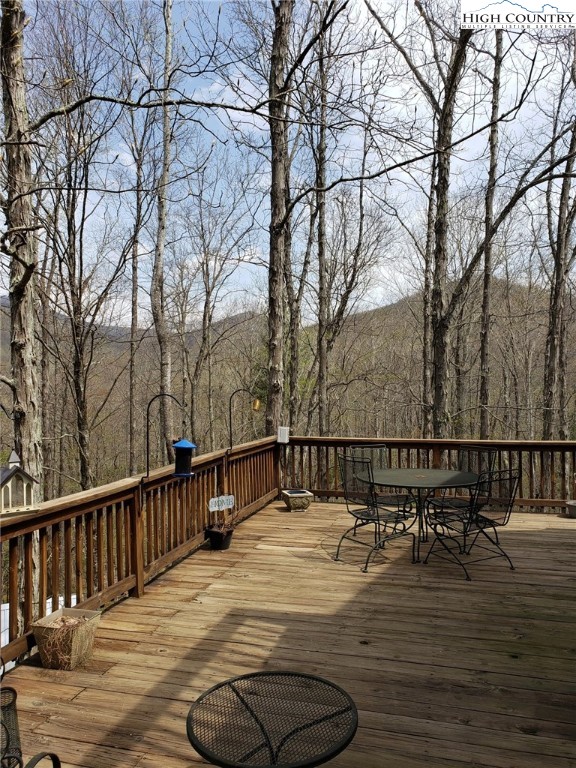 237 Green Knob Mtn Road Boone, NC 28607 - Photo 29 of 41 a view of a roof deck with wooden floor and fence