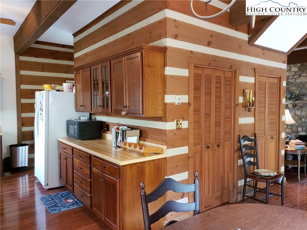 237 Green Knob Mtn Road Boone, NC 28607 - Photo 5 of 41 a kitchen that has a sink a refrigerator and cabinets