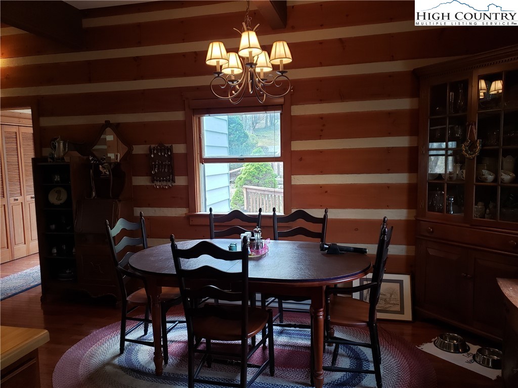 237 Green Knob Mtn Road Boone, NC 28607 - Photo 7 of 41 a view of a dining room with furniture and chandelier