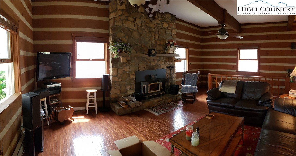 237 Green Knob Mtn Road Boone, NC 28607 - Photo 8 of 41 a living room with furniture and a fireplace
