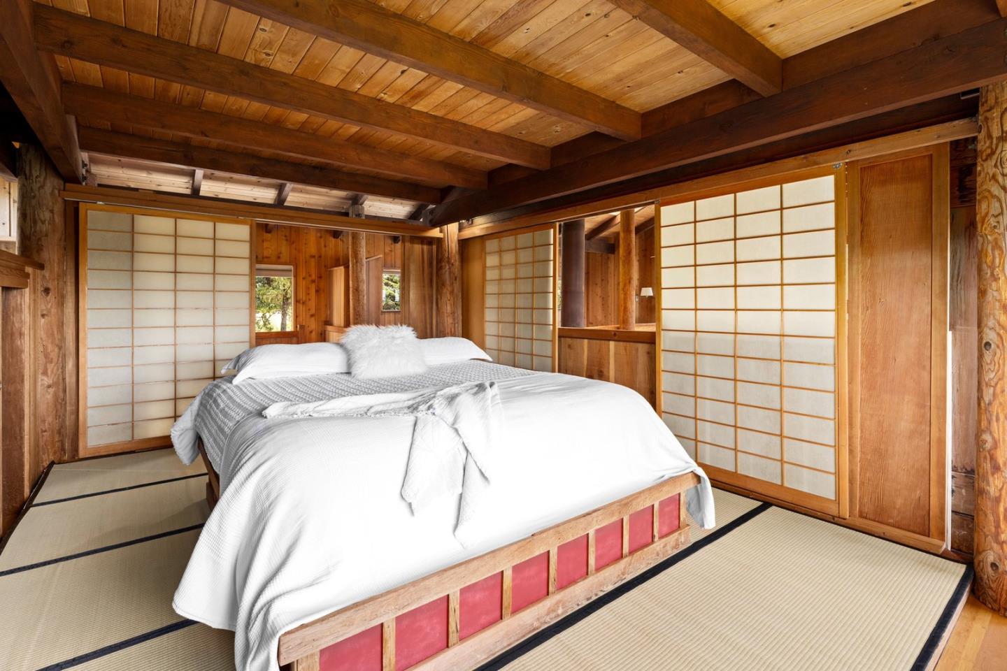 73 Mt Devon Road Carmel Highlands, CA 93923 - Photo 35 of 88 a bed sitting in a bedroom next to a window