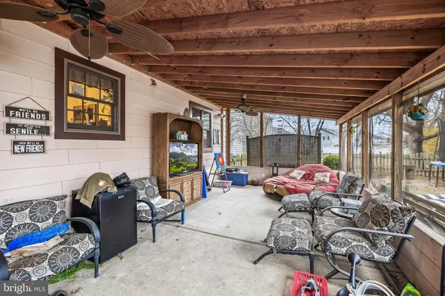a living room with furniture a couch and a table