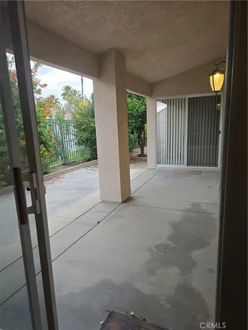 a front view of a house with a yard and parking