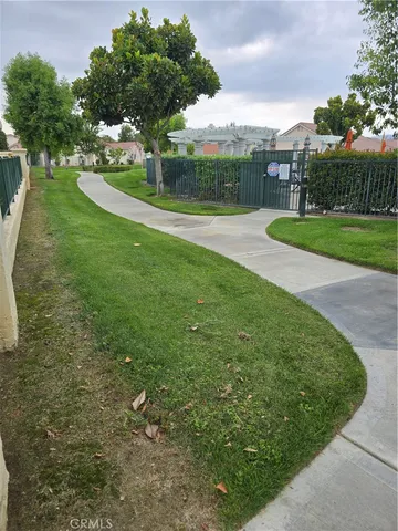 a view of a house with swimming pool and sitting area