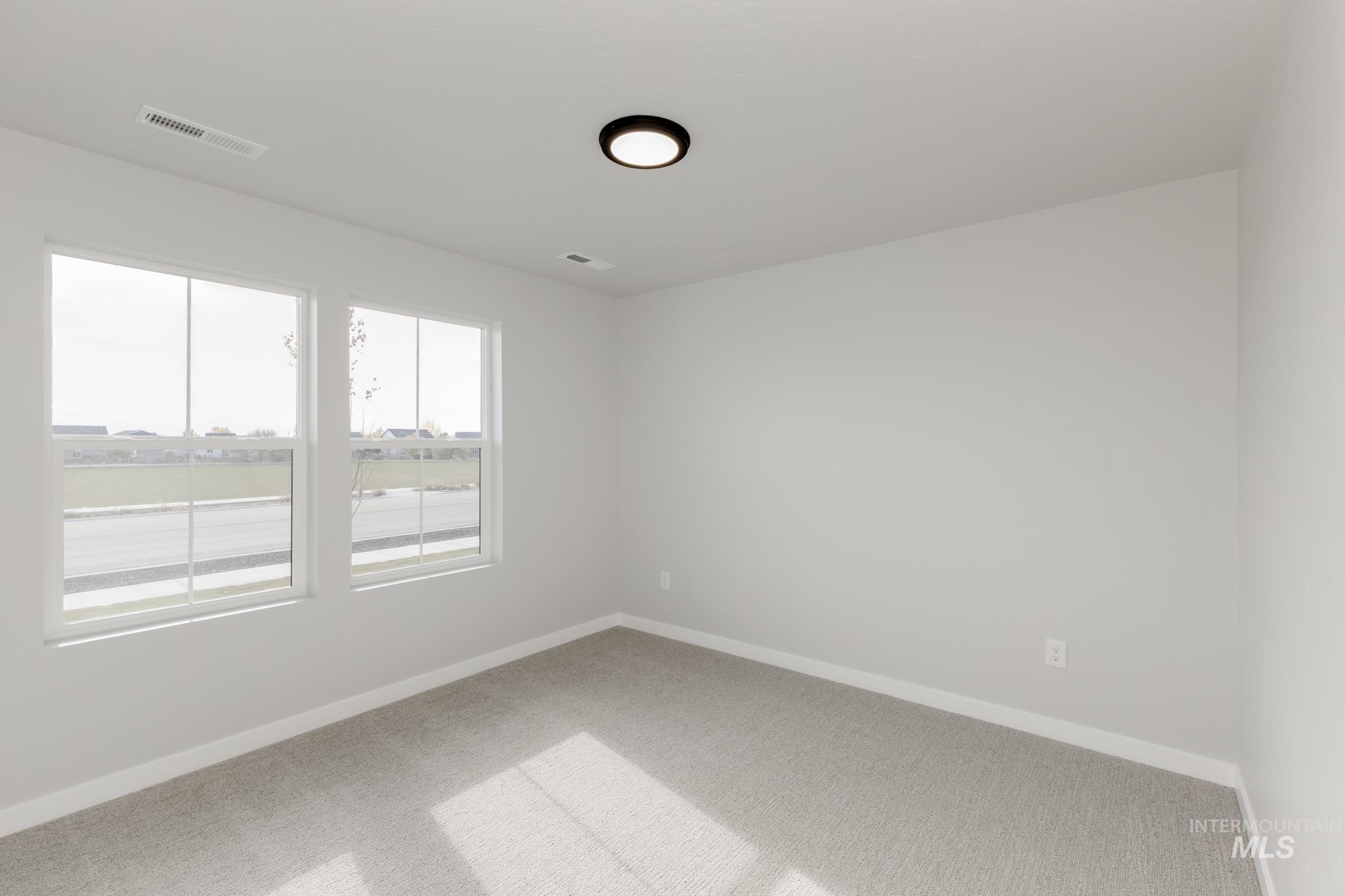 1804 West Unforgettable Street Meridian, ID 83642 - Photo 11 of 18 Carpeted spare room with baseboards