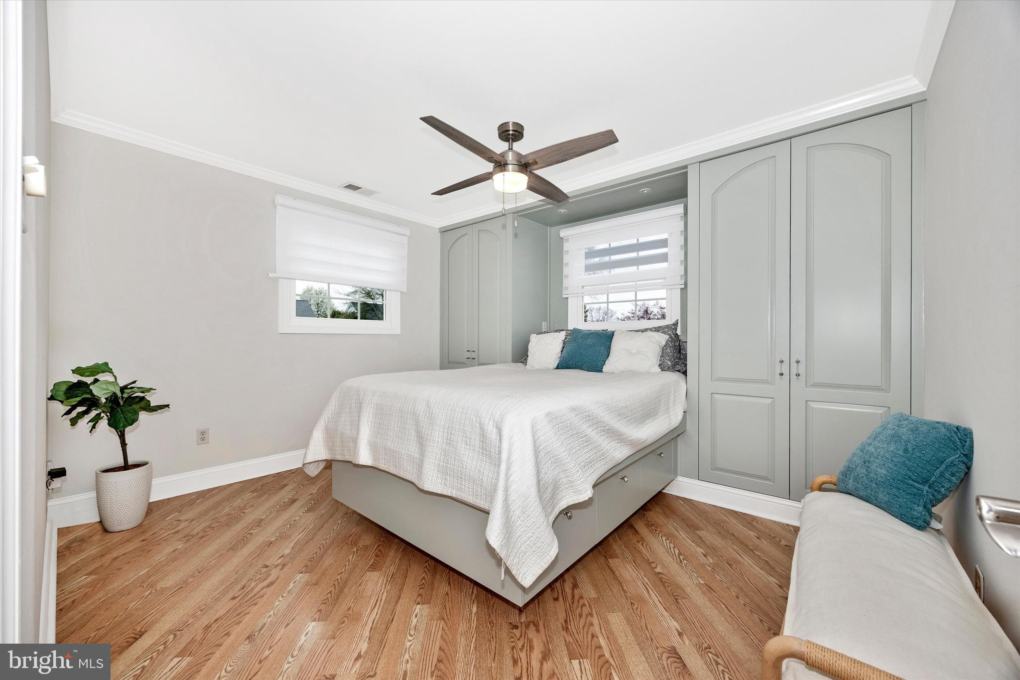 307 Redwood Avenue Frederick, MD 21701 - Photo 11 of 23 a bedroom with a bed and a potted plant