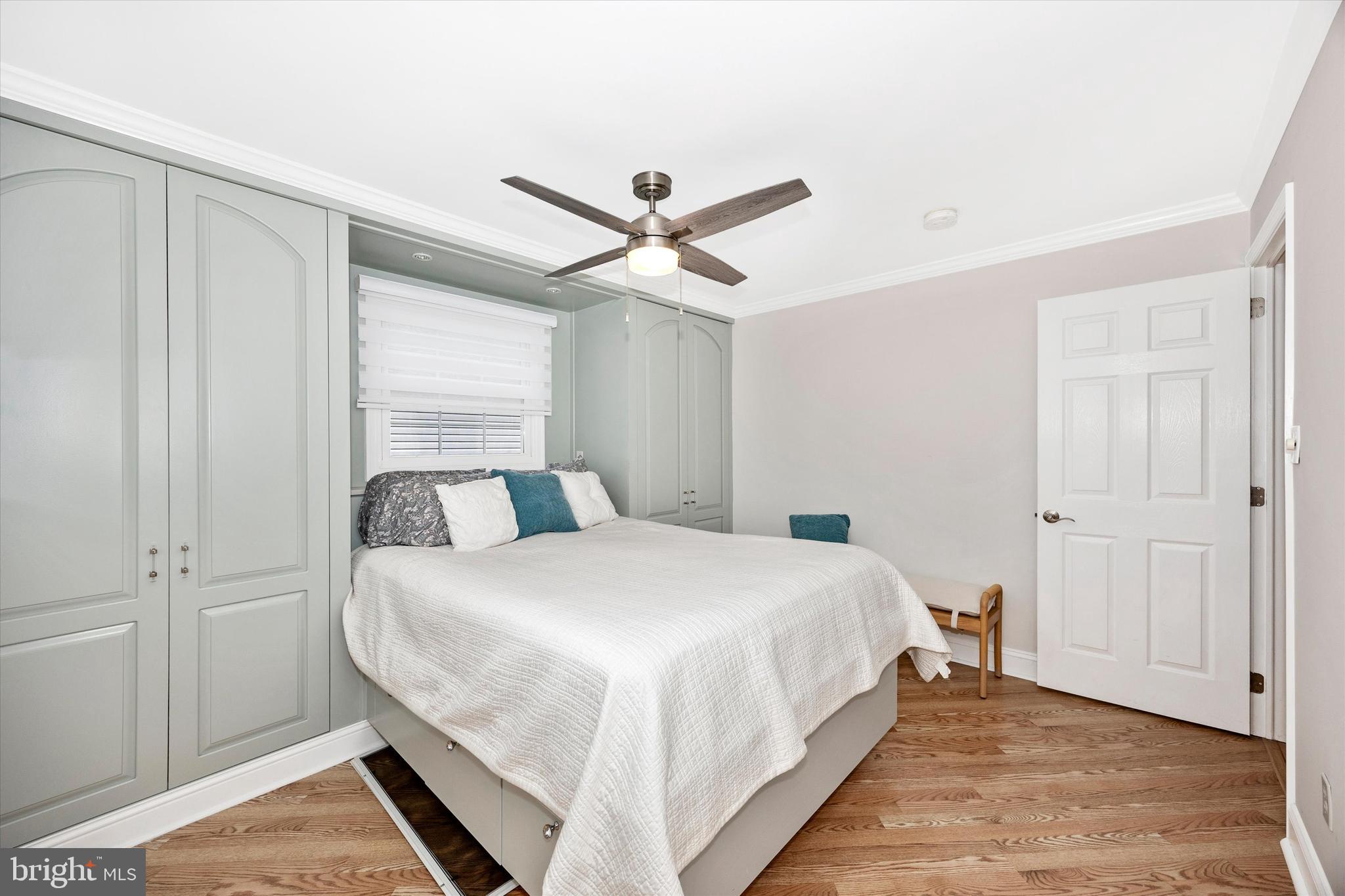 307 Redwood Avenue Frederick, MD 21701 - Photo 12 of 23 a bedroom with a bed and a ceiling fan