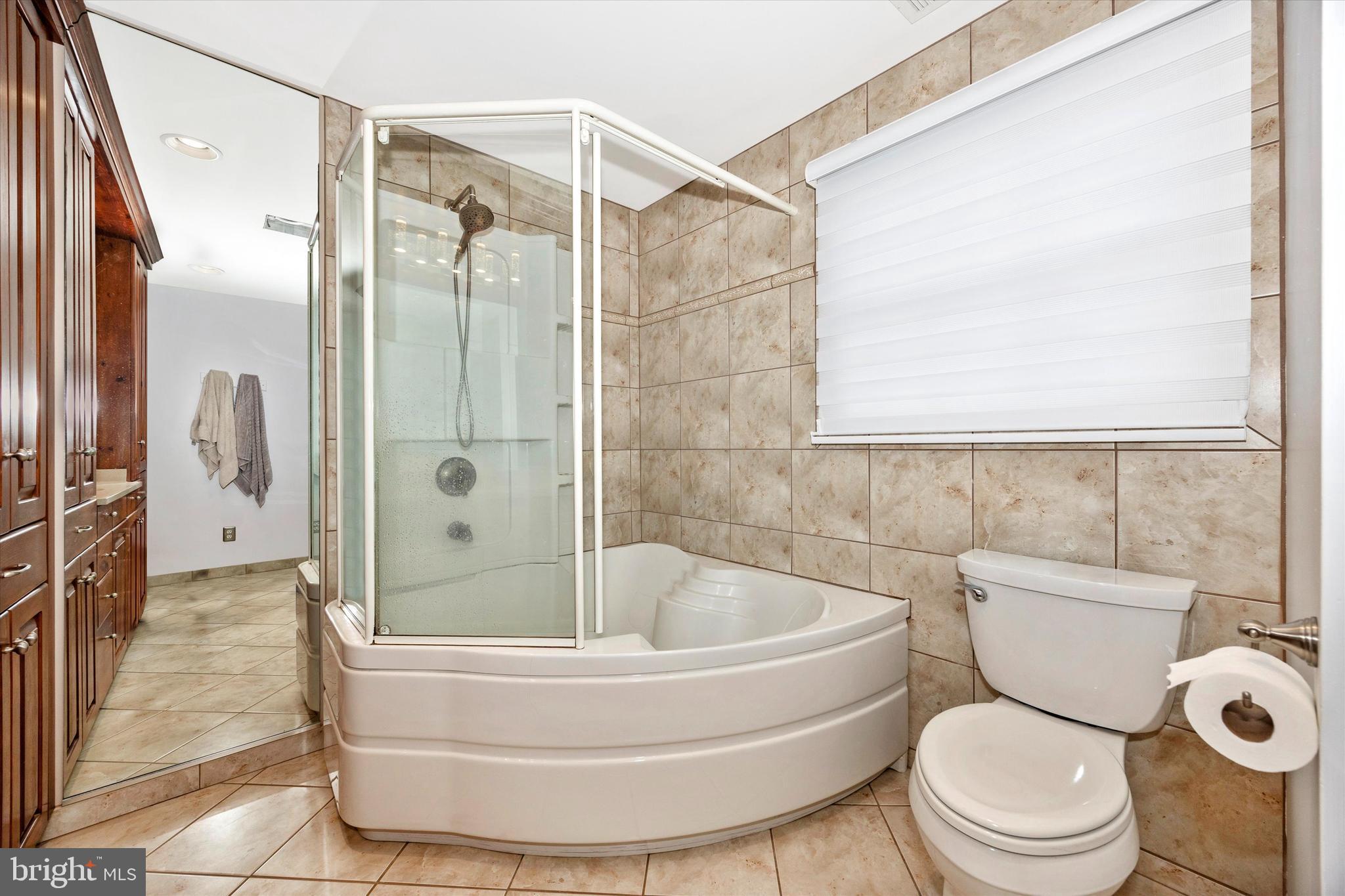 307 Redwood Avenue Frederick, MD 21701 - Photo 15 of 23 a bathroom with a toilet and a shower
