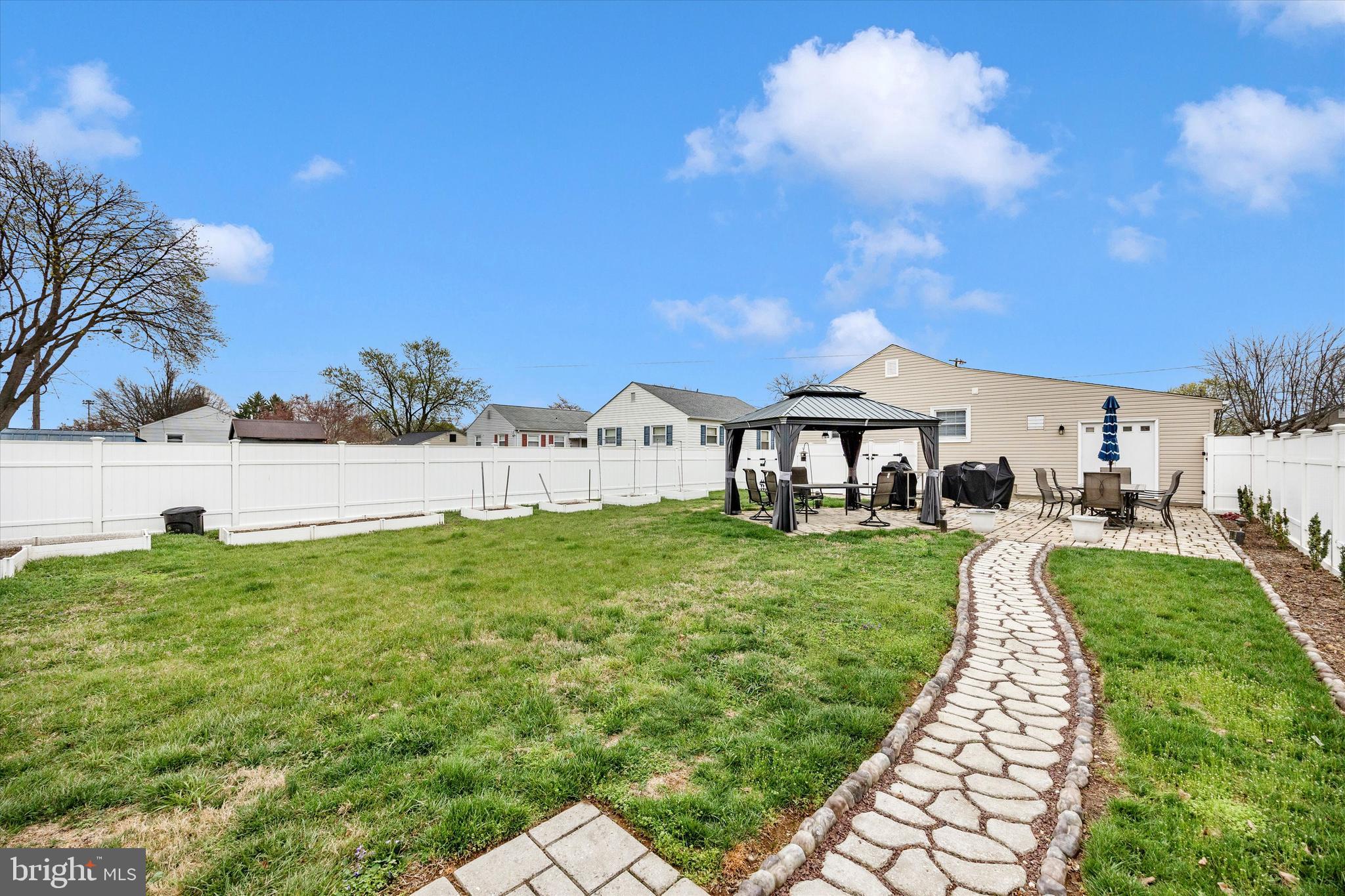 307 Redwood Avenue Frederick, MD 21701 - Photo 20 of 23 a front view of a house with garden