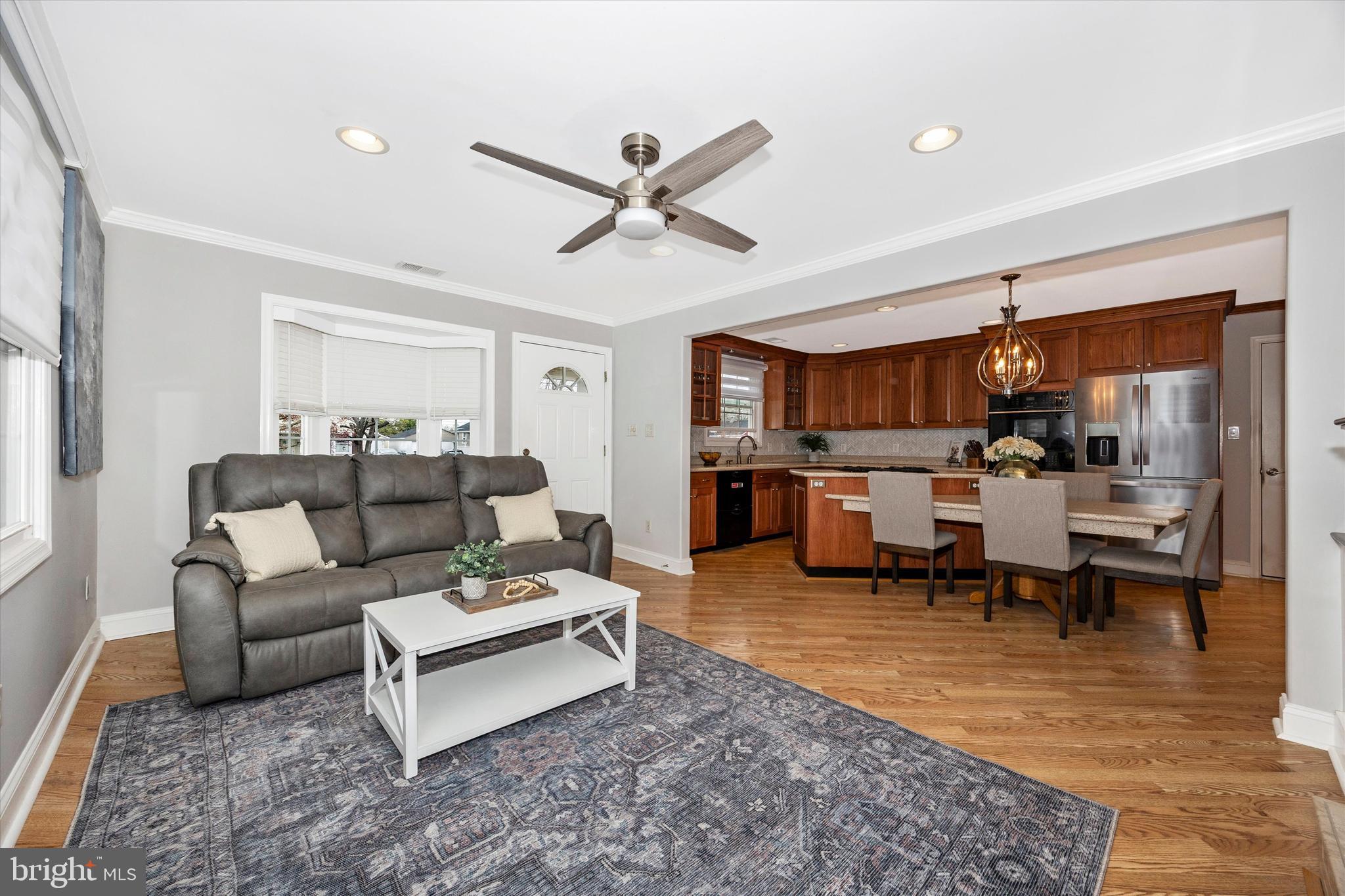 307 Redwood Avenue Frederick, MD 21701 - Photo 4 of 23 a living room with furniture and kitchen view