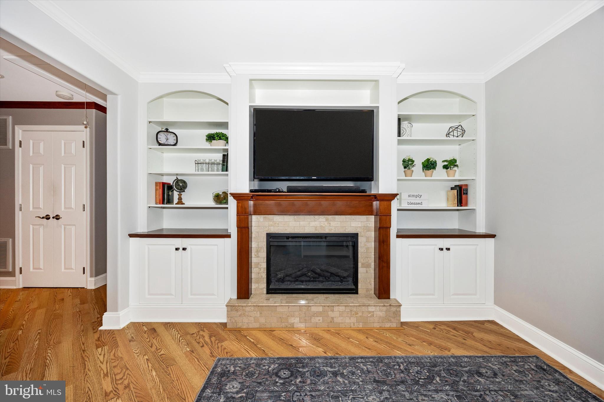 307 Redwood Avenue Frederick, MD 21701 - Photo 5 of 23 a living room with furniture and a fireplace