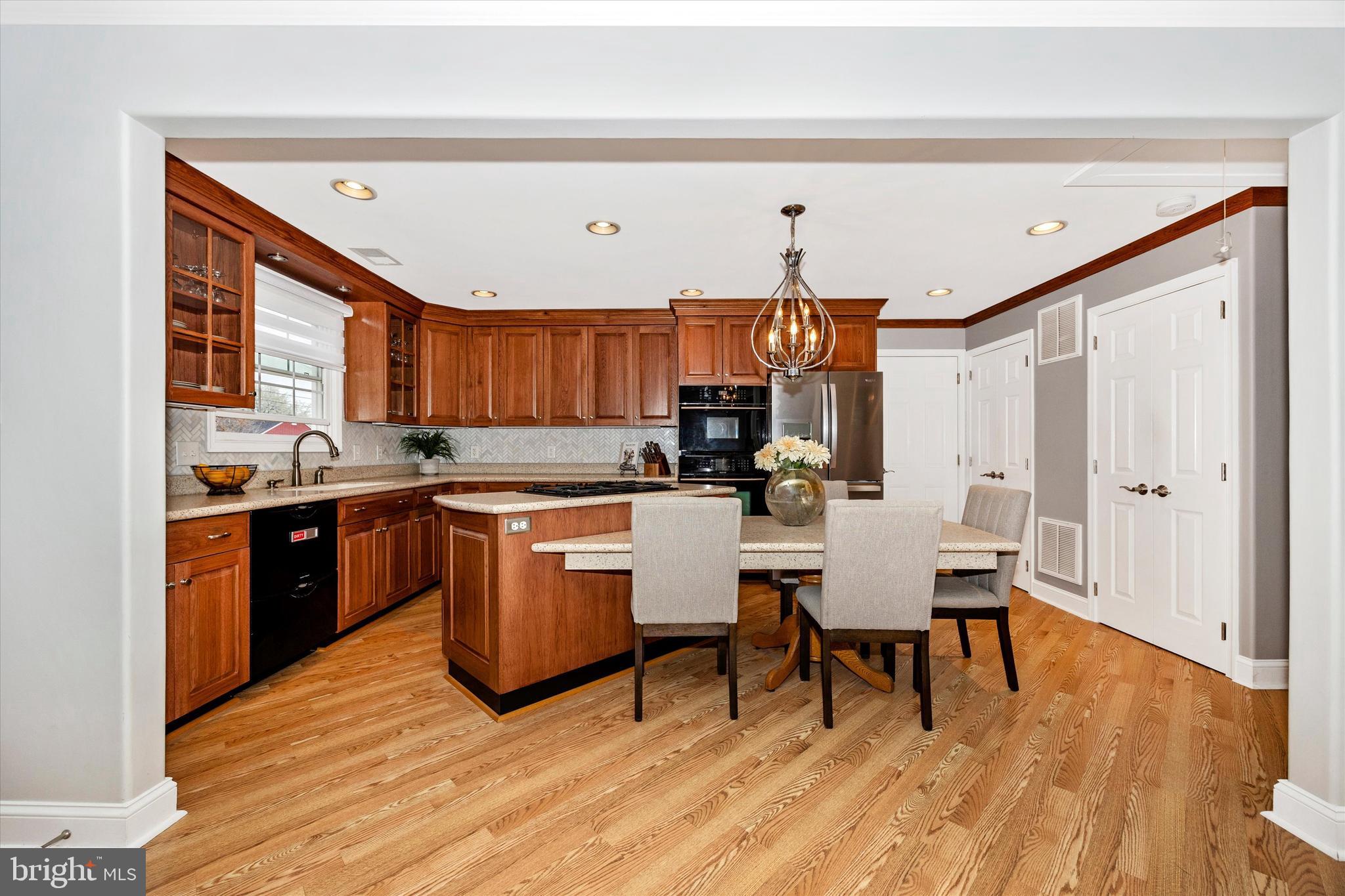 307 Redwood Avenue Frederick, MD 21701 - Photo 6 of 23 a kitchen with a sink cabinets and wooden floor