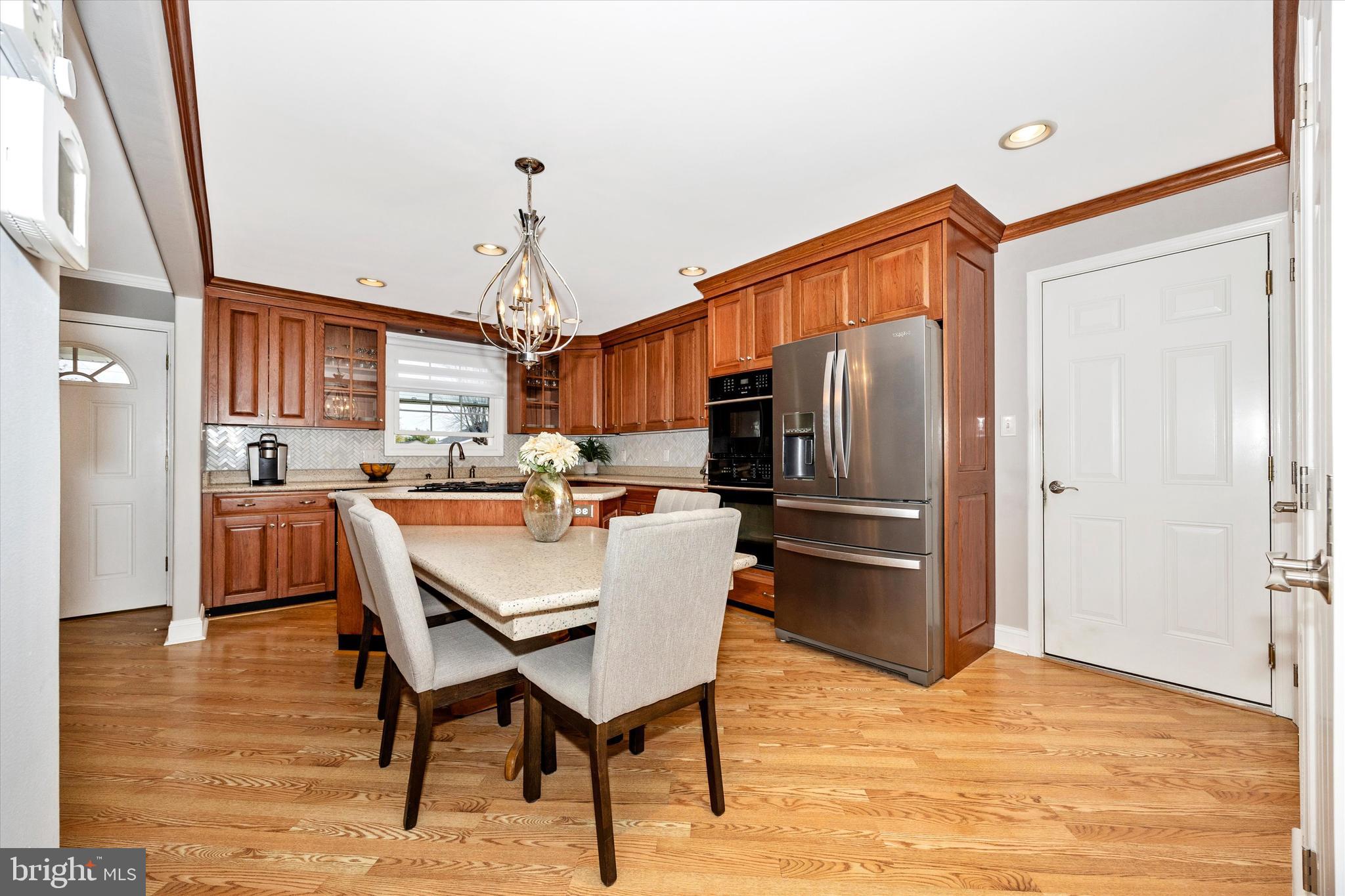 307 Redwood Avenue Frederick, MD 21701 - Photo 9 of 23 a kitchen with stainless steel appliances granite countertop a refrigerator and microwave