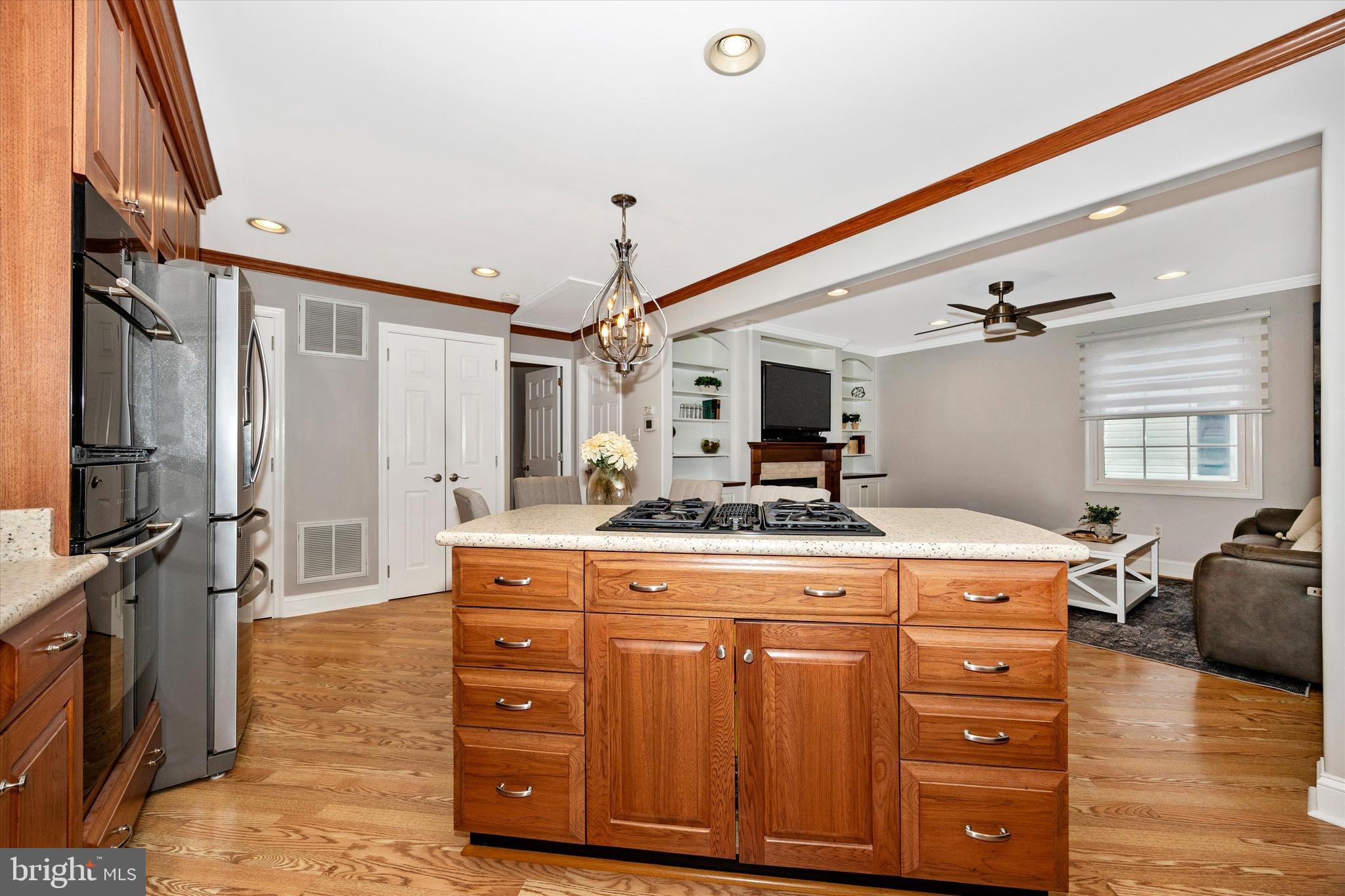 307 Redwood Avenue Frederick, MD 21701 - Photo 10 of 23 a kitchen with a stove a sink and a refrigerator