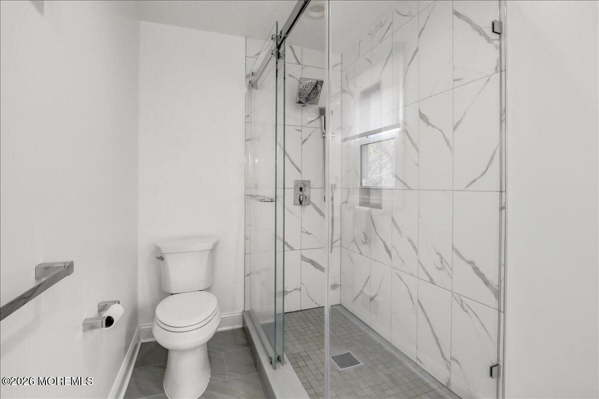 21 Prince William Road Morganville, NJ 07751 - Photo 19 of 39 a bathroom with a toilet and a shower