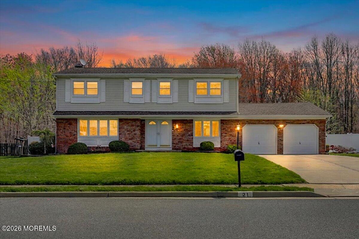 21 Prince William Road Morganville, NJ 07751 - Photo 2 of 39 a front view of a house with a yard
