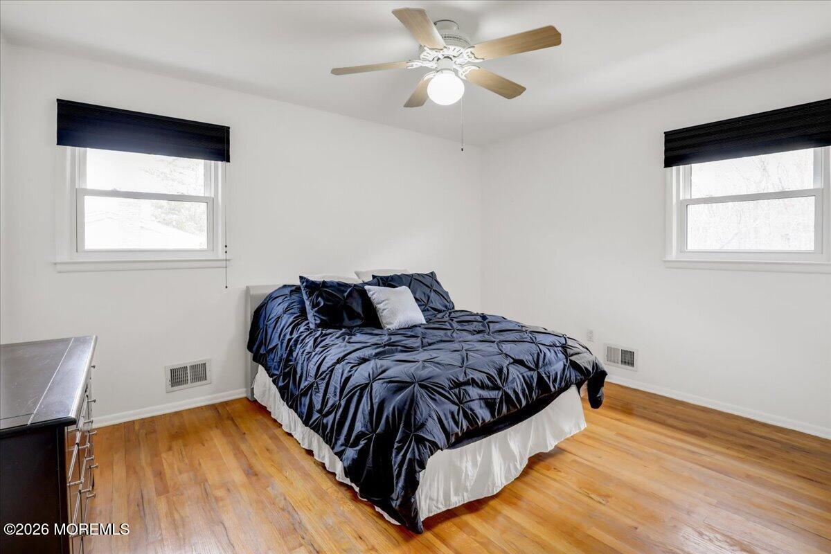 21 Prince William Road Morganville, NJ 07751 - Photo 21 of 39 a spacious bedroom with a bed and a window