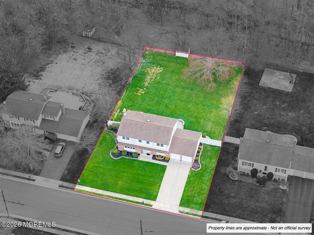 21 Prince William Road Morganville, NJ 07751 - Photo 30 of 39 an aerial view of a house with a garden
