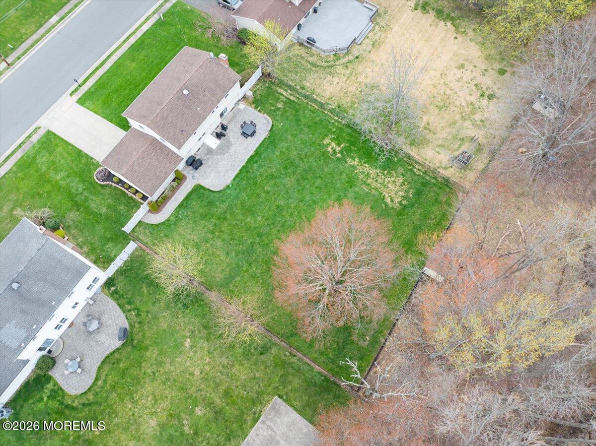 21 Prince William Road Morganville, NJ 07751 - Photo 35 of 39 an aerial view of a house with a garden and mountain view