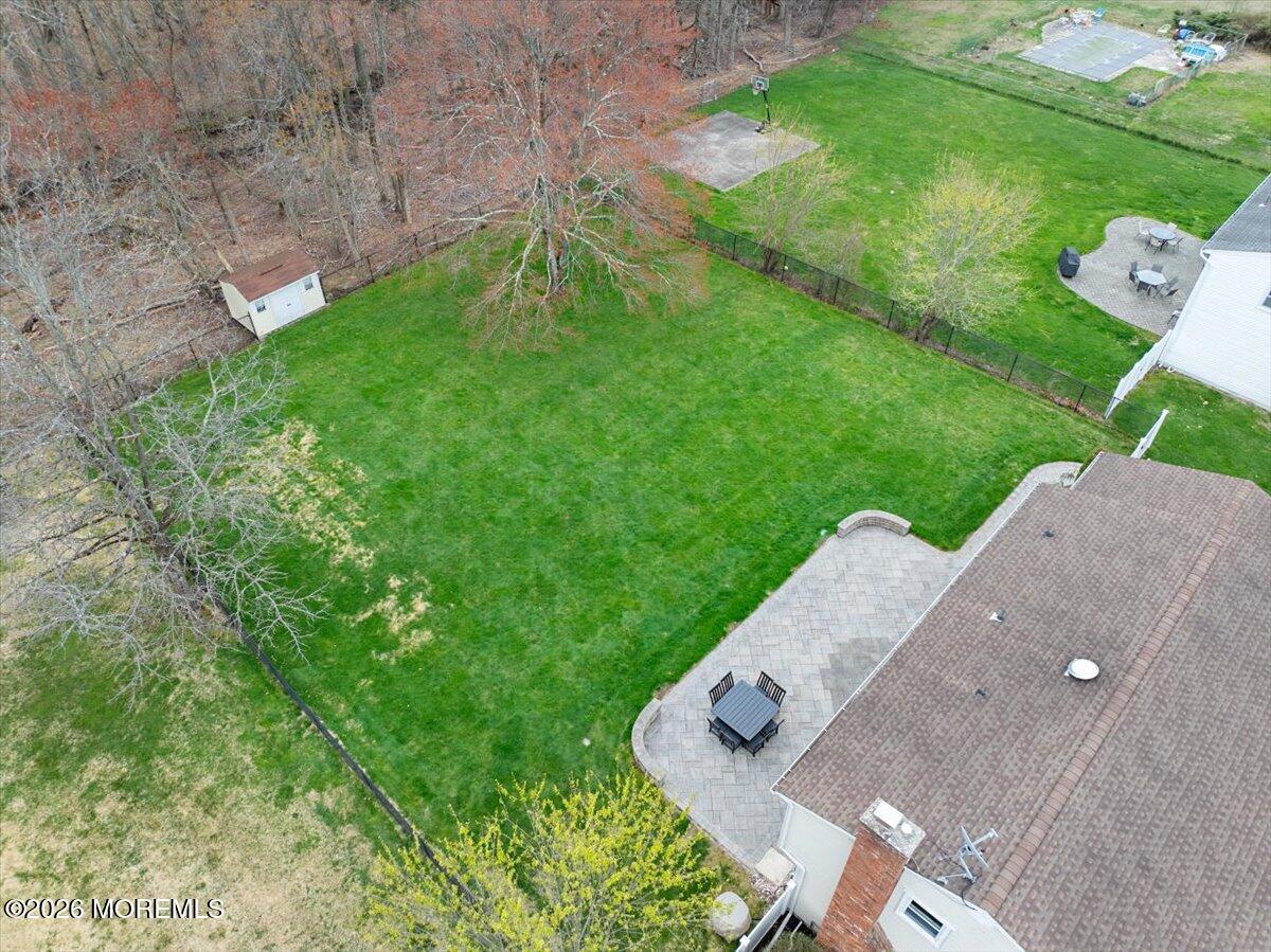 21 Prince William Road Morganville, NJ 07751 - Photo 36 of 39 an aerial view of a house with a yard