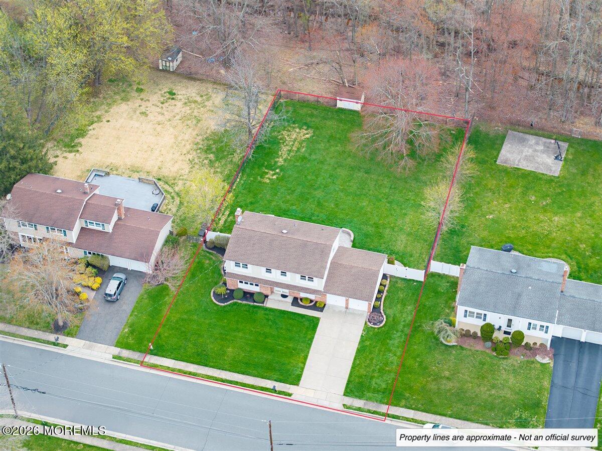 21 Prince William Road Morganville, NJ 07751 - Photo 38 of 39 an aerial view of a house with garden space and street view