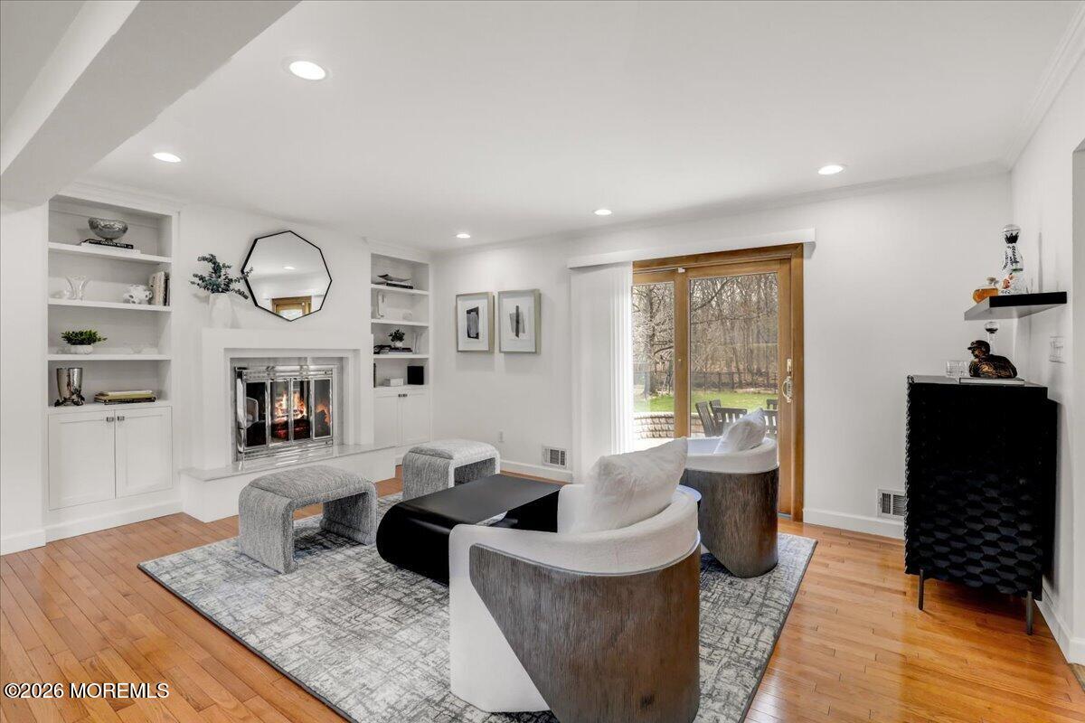 21 Prince William Road Morganville, NJ 07751 - Photo 7 of 39 a living room with furniture large window and wooden floor