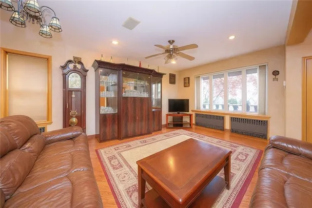 a living room with a large window table and chairs