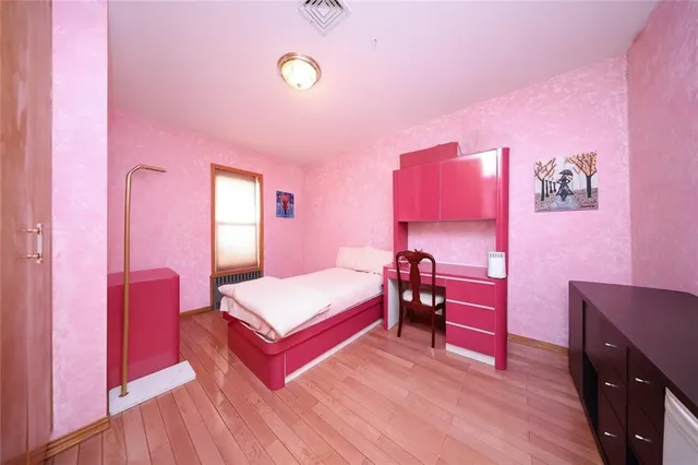 a bedroom with a bed and a table