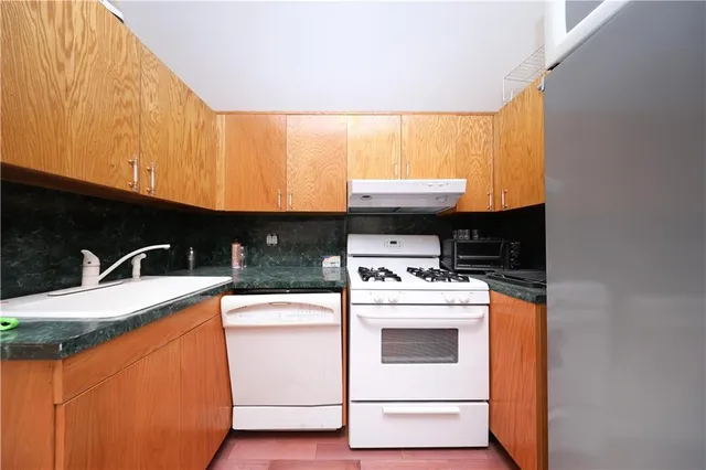 a kitchen with a stove and a microwave