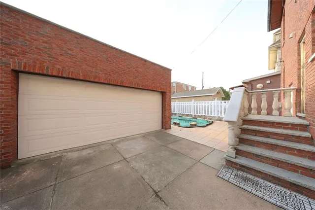 a backyard of a house with basket ball court