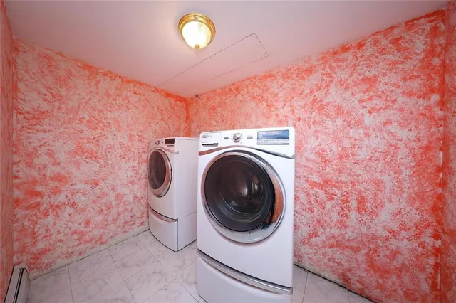 a utility room with dryer and washer