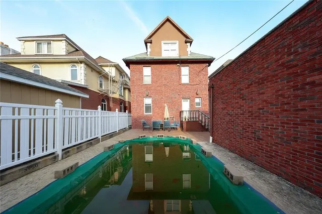a view of swimming pool from a balcony