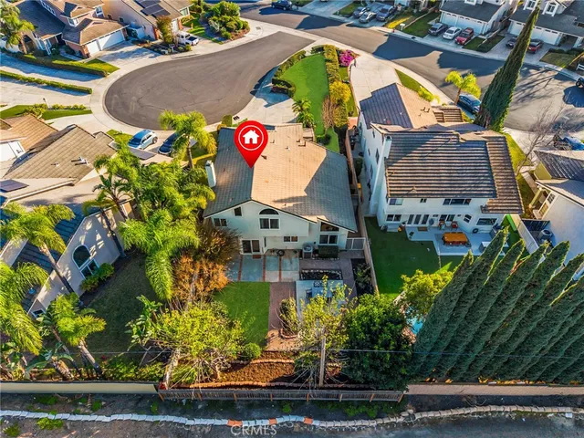 an aerial view of residential building and car parked