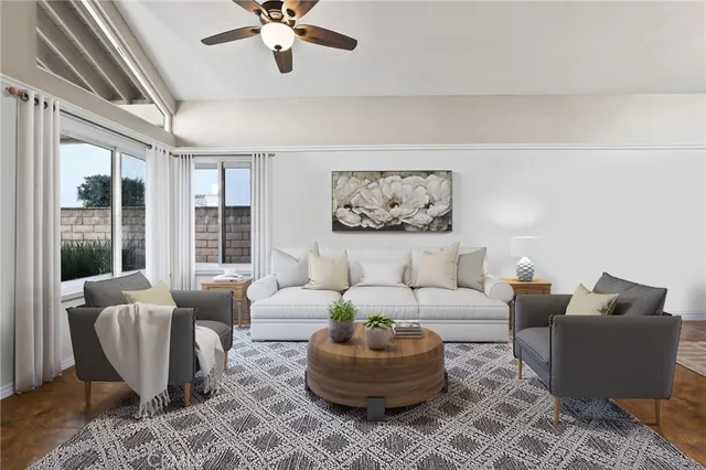 a living room with furniture and a large window