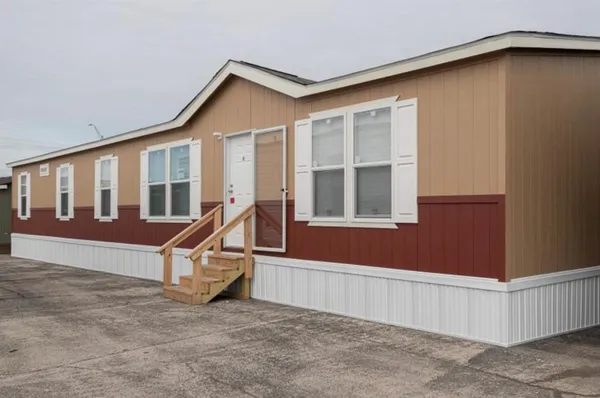 a view of wooden house with a park